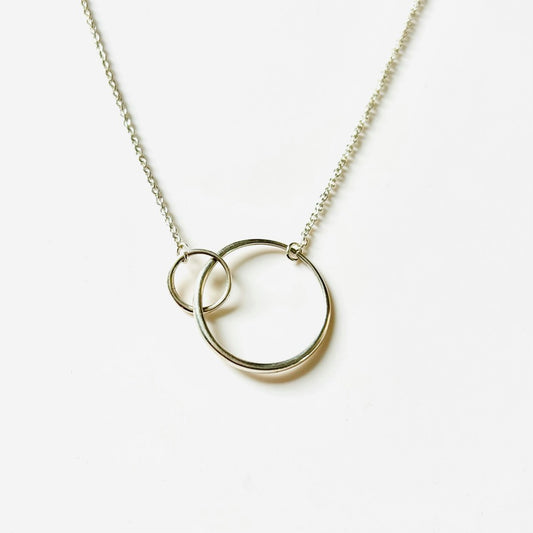 Saturn Necklace Rings in Sterling Silver by Hannah Daye & Co