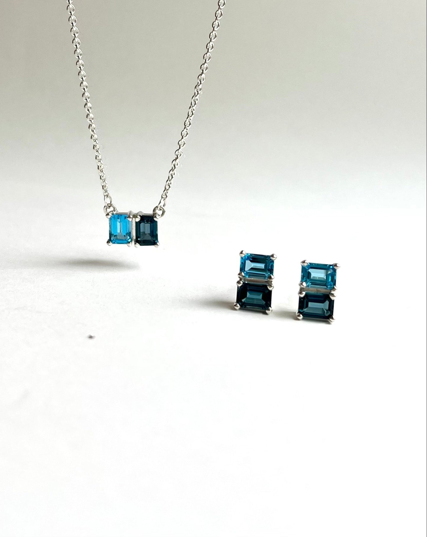 Swiss Blue Topaz & London Blue Topaz Lexington Earrings and Necklace shown together all by Hannah Daye & Co fine jewelry