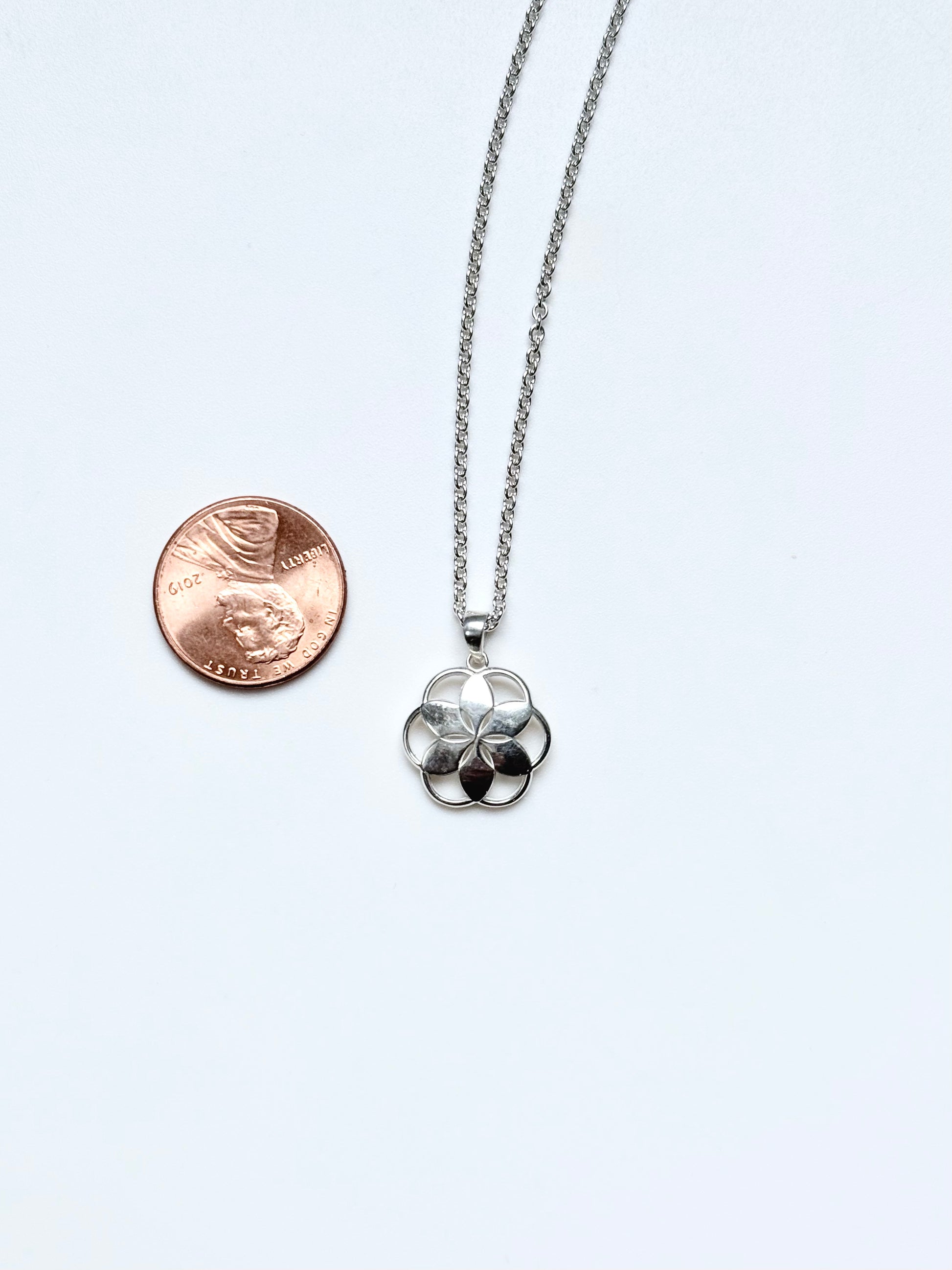 Piccolo Pendant Shown with penny for scale jewelry by Hannah Daye original design