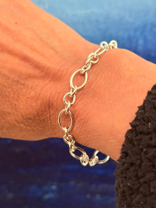 wearing Cascade sterling silver bracelet by Hannah Daye jewelry