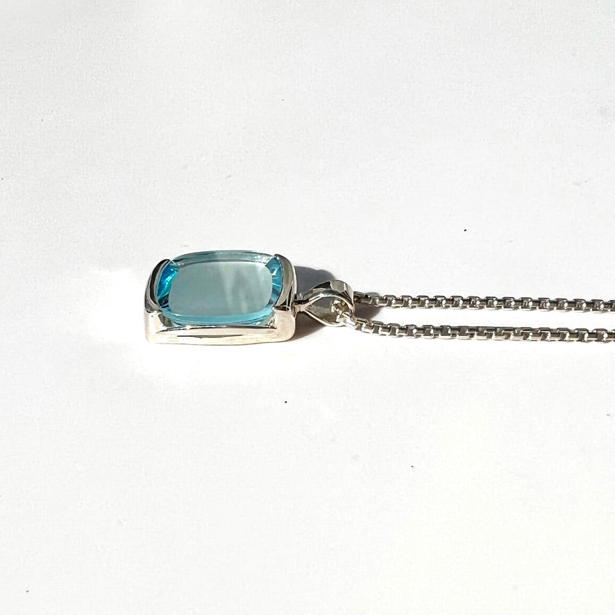 Side view of Milan Sky Blue Topaz pendant by Hannah Daye