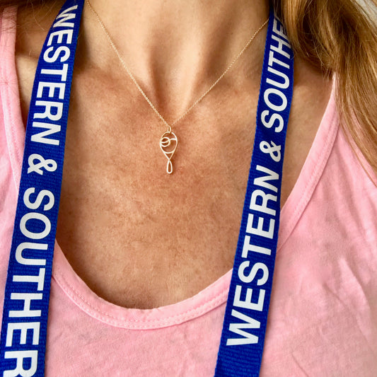 Deuce Tennis Charm Pendant 14k gold wearing with Western & Southern badge Hannah Daye & Company