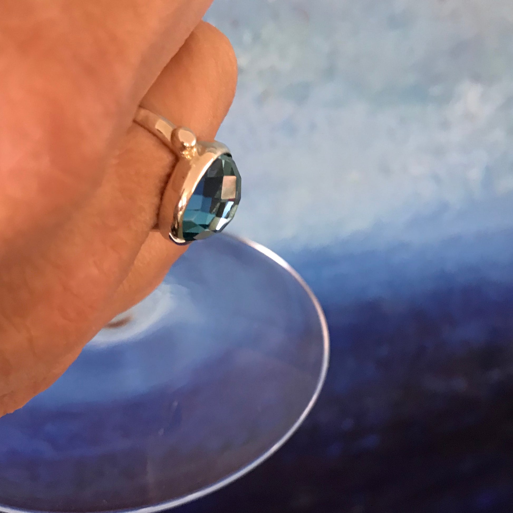 Sabine North South Swiss Blue topaz ring holding Martini Glass Hannah Daye & Co