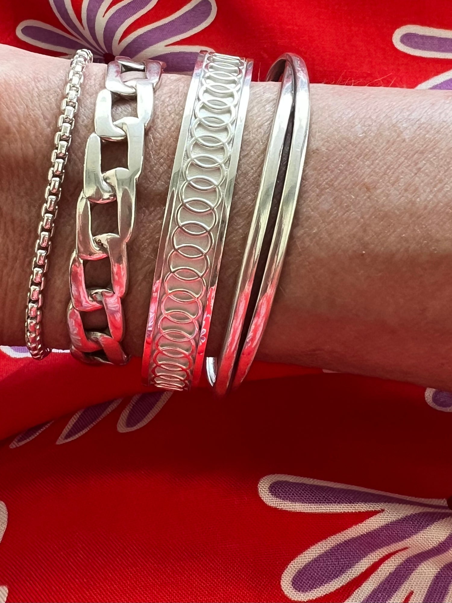 Stack of sterling silver bracelets by Hannah Daye & Co