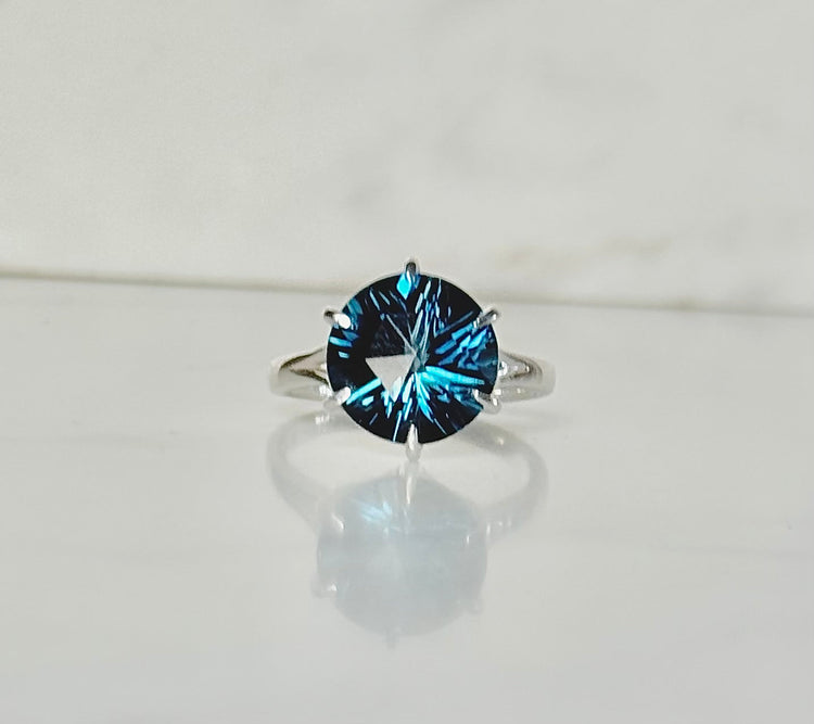 London Blue Topaz Brillante COcktail Ring in Sterling Silver by Hannah Daye on white marble surface