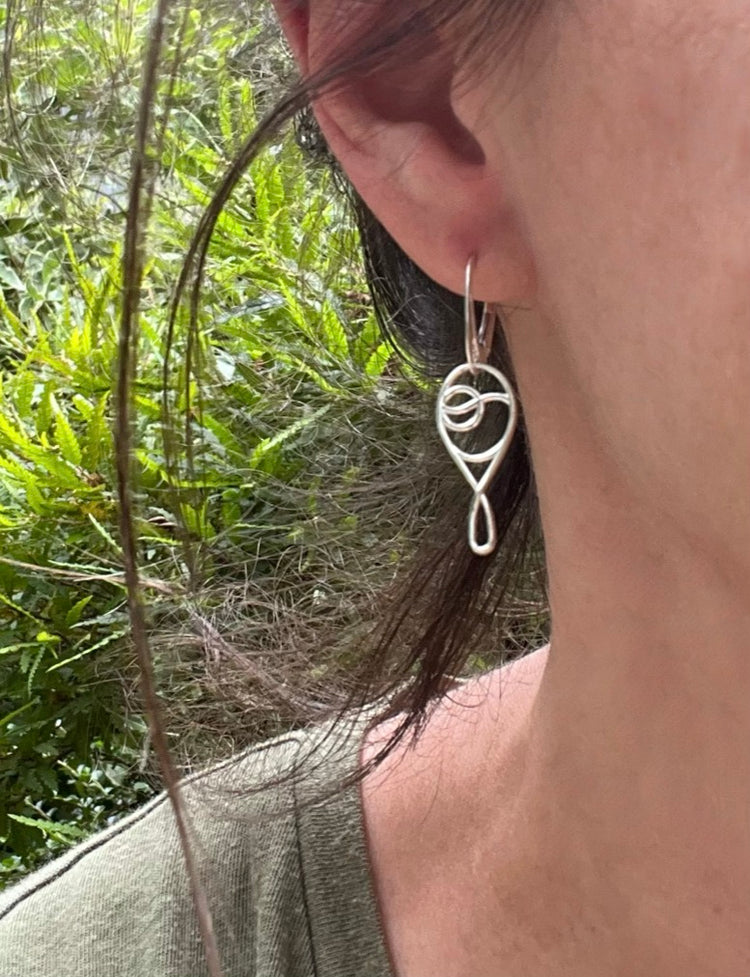 wearing deuce tennis earrings sterling silver with lever back by hannah daye