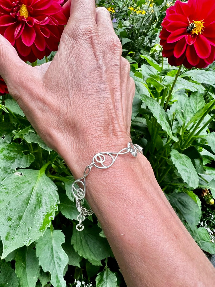 reaching for Dahlias and wearing Deuce Tennis Sterling Silver Bracelet by Hannah Daye