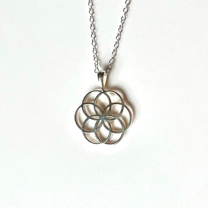 Rosette Fiore open-work pendant by Hannah Daye & Co