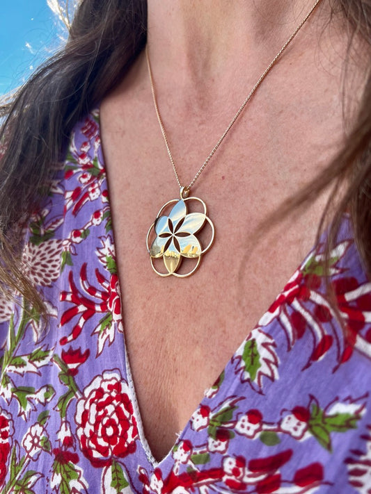 wearing Hannah Daye signature Rosette Pendant in solid 14k gold on an 18" chain beautiful style timeless design original