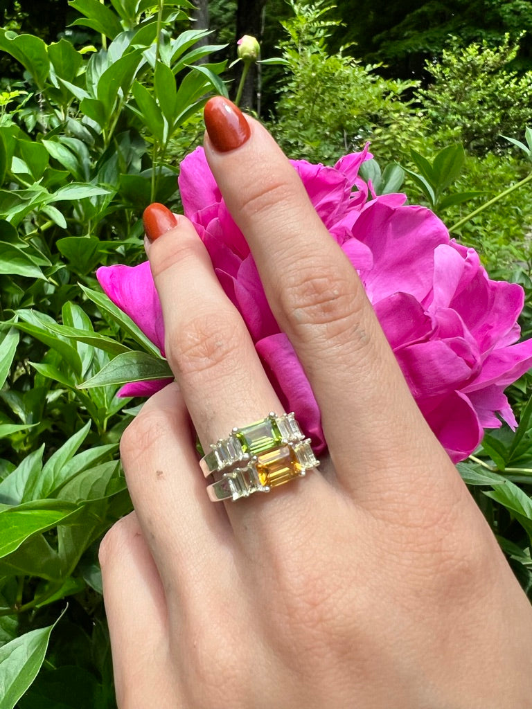 LExi Band Sterling Silver Rings stacked Peridot Citrine Emerald cut East West gemstone jewelry by Hannah Daye & Co shown with pink peony