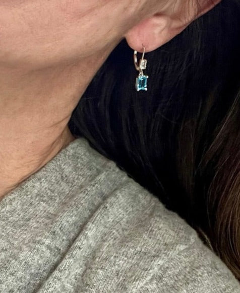 Wearing Lexi Drops and Lexington Triple necklace blue topaz by Hannah Daye fine jewelry original designs