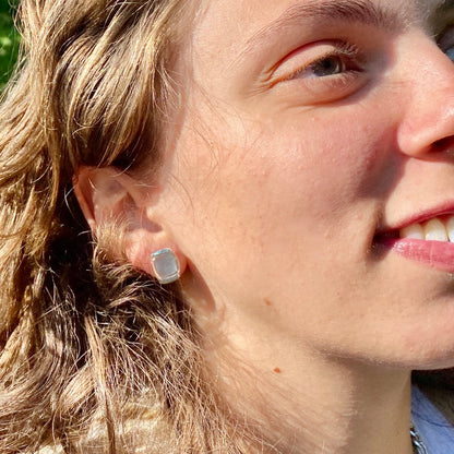 wearing Milan post earrings sterling silver mother of pearl by Hannah Daye fine jewelry