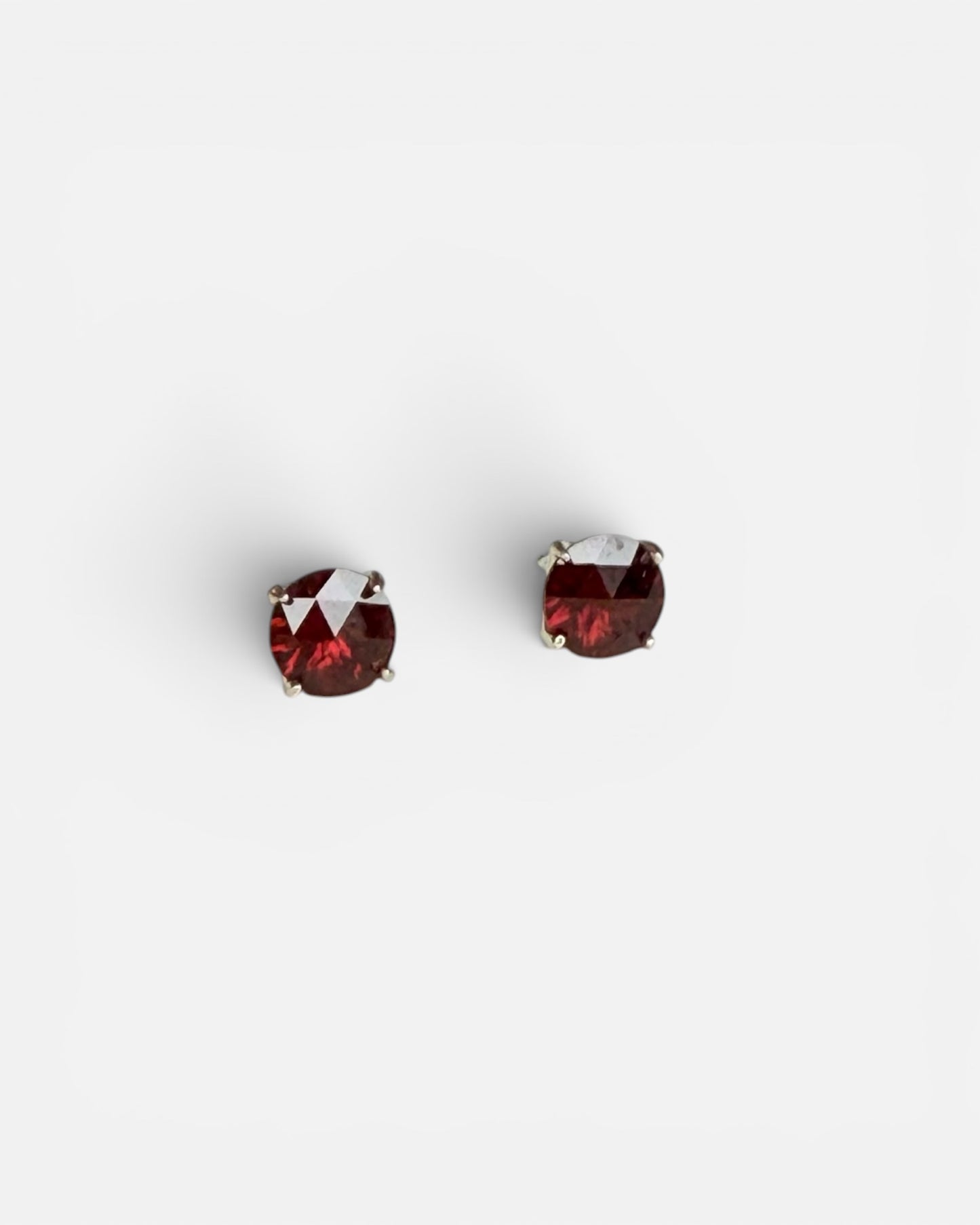 Pair of Red Garnet earrings on White background