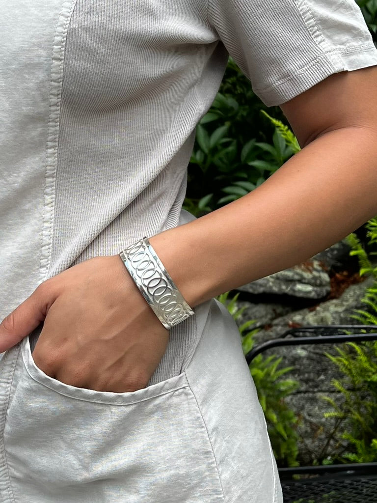 wearing Oslo cuff sterling silver original design by Hannah Daye & Co fine jewelry