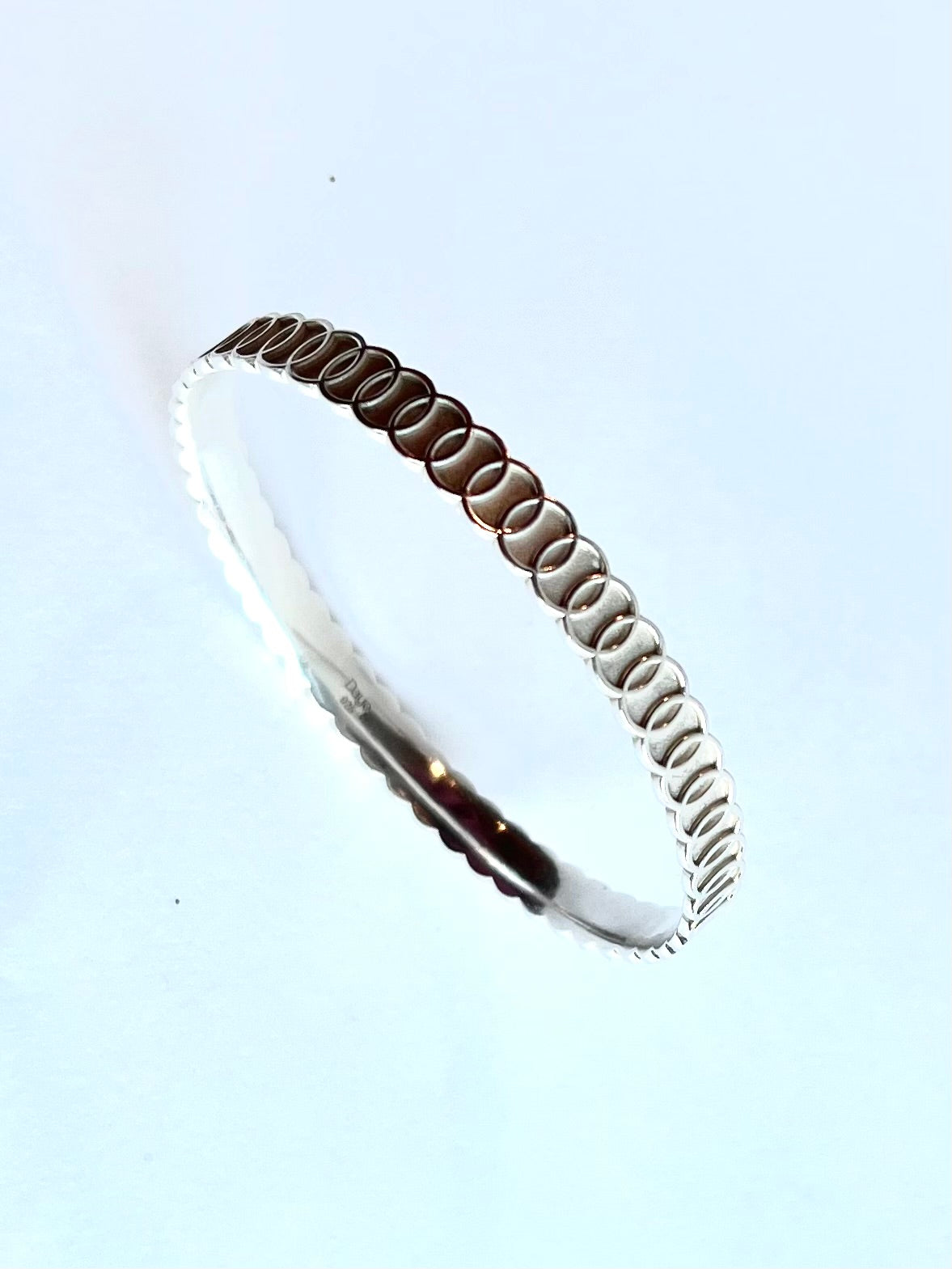 Angle view of oval Oslo Bangle by Hannah Daye & Co sterling silver