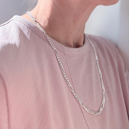 wearing Figaro style chain necklace sterling silver by Hannah Daye jewelry