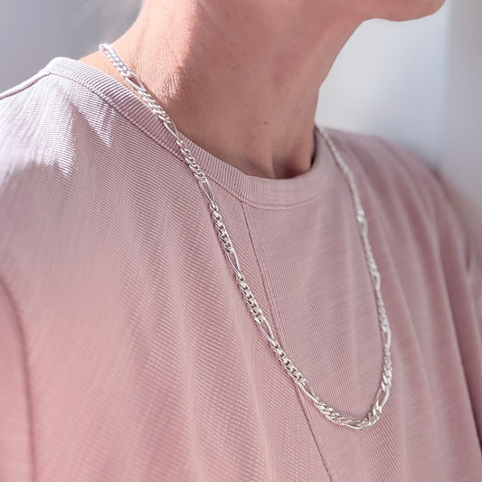 wearing Figaro style chain necklace sterling silver by Hannah Daye jewelry