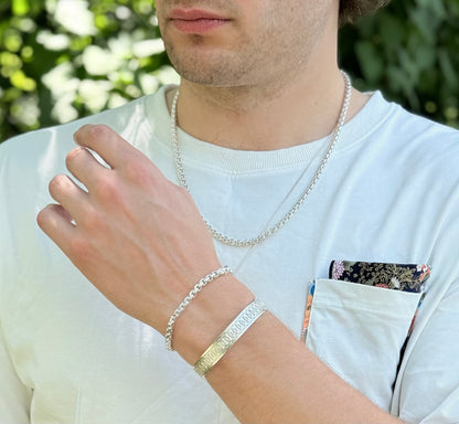 wearing Oslo Narrow Cuff with Venetian Bracelet and Venetian Grand Necklace all sterling silver by Hannah Daye jewelry mens jewelry