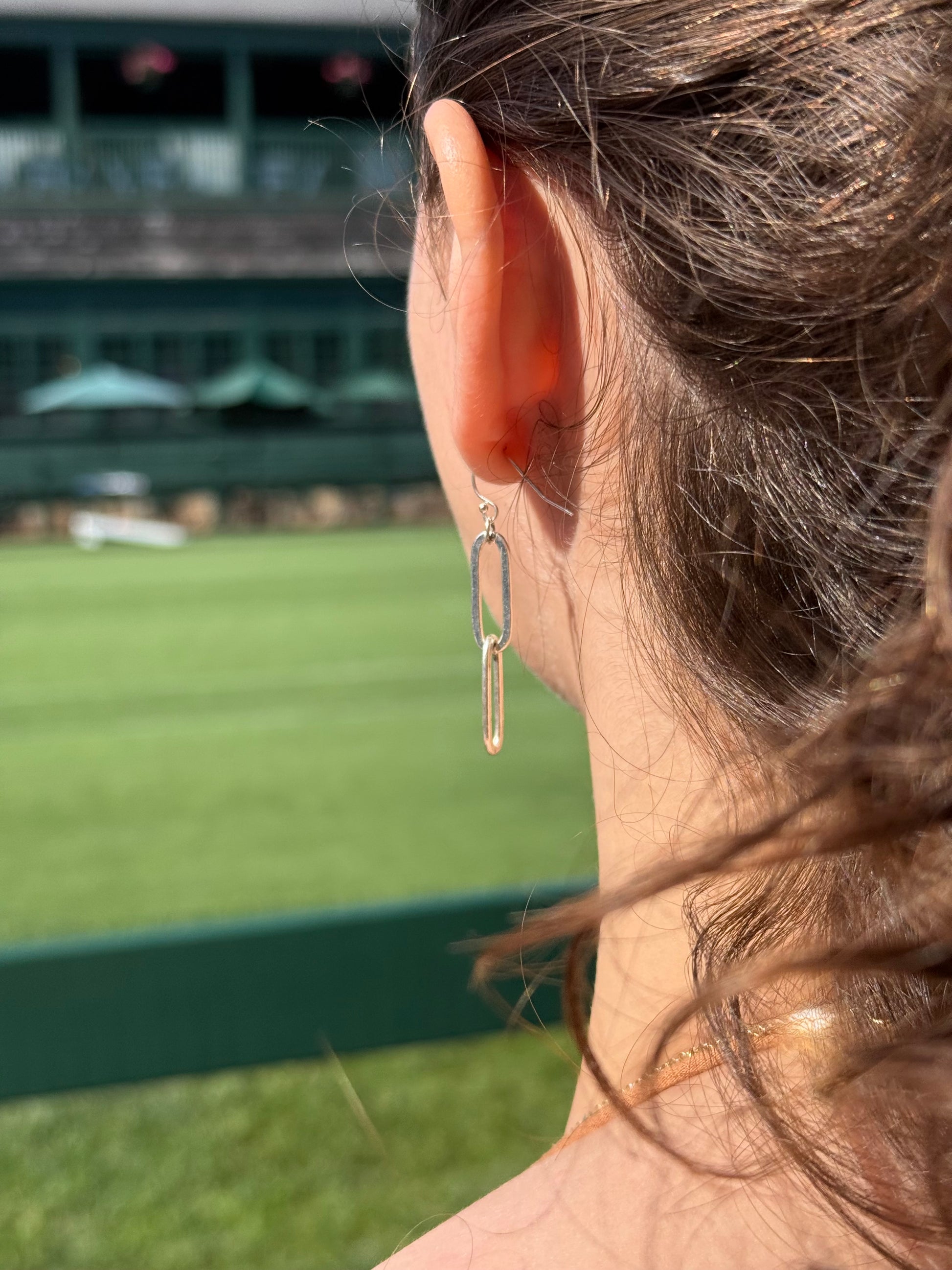 wearing Paper-Clip Sterling Silver Dangle Earrings by Hannah Daye