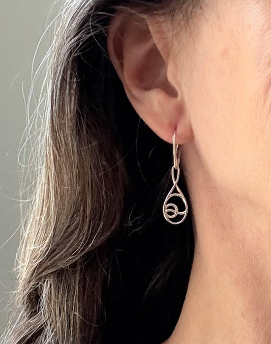 wearing Deuce Tennis leverback earrings sterling silver by Hannah Daye fine jewelry original designs