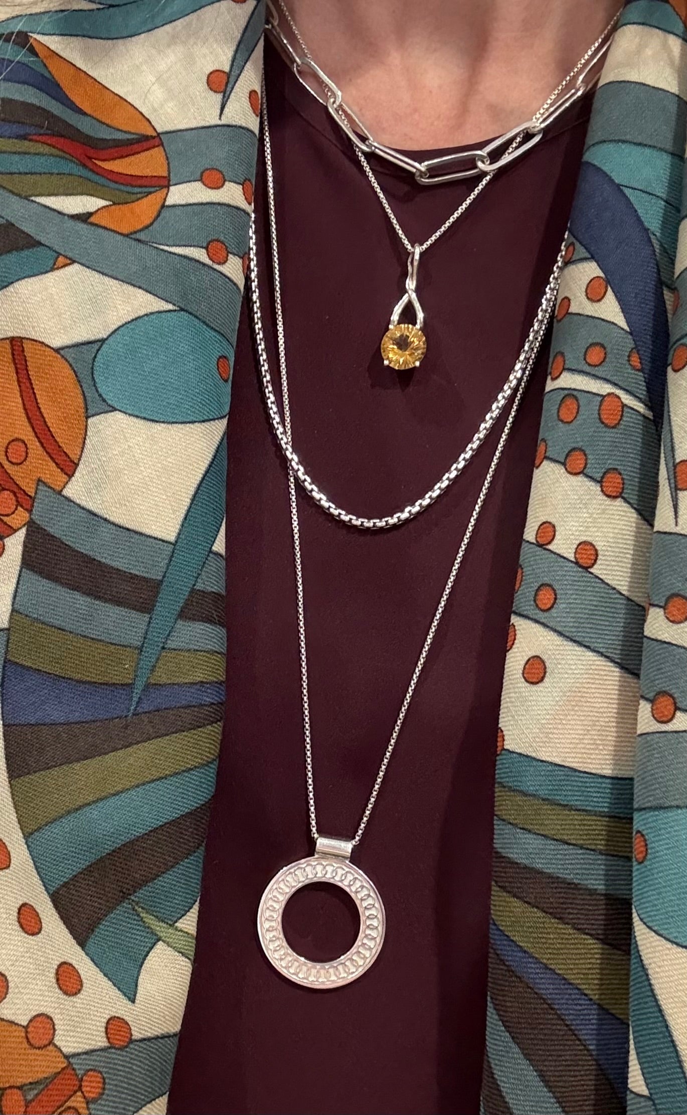 Oslo Pendant layered with Citrine Brillante Pendant Venetian and Paper-Clip Necklaces all by Hannah Daye