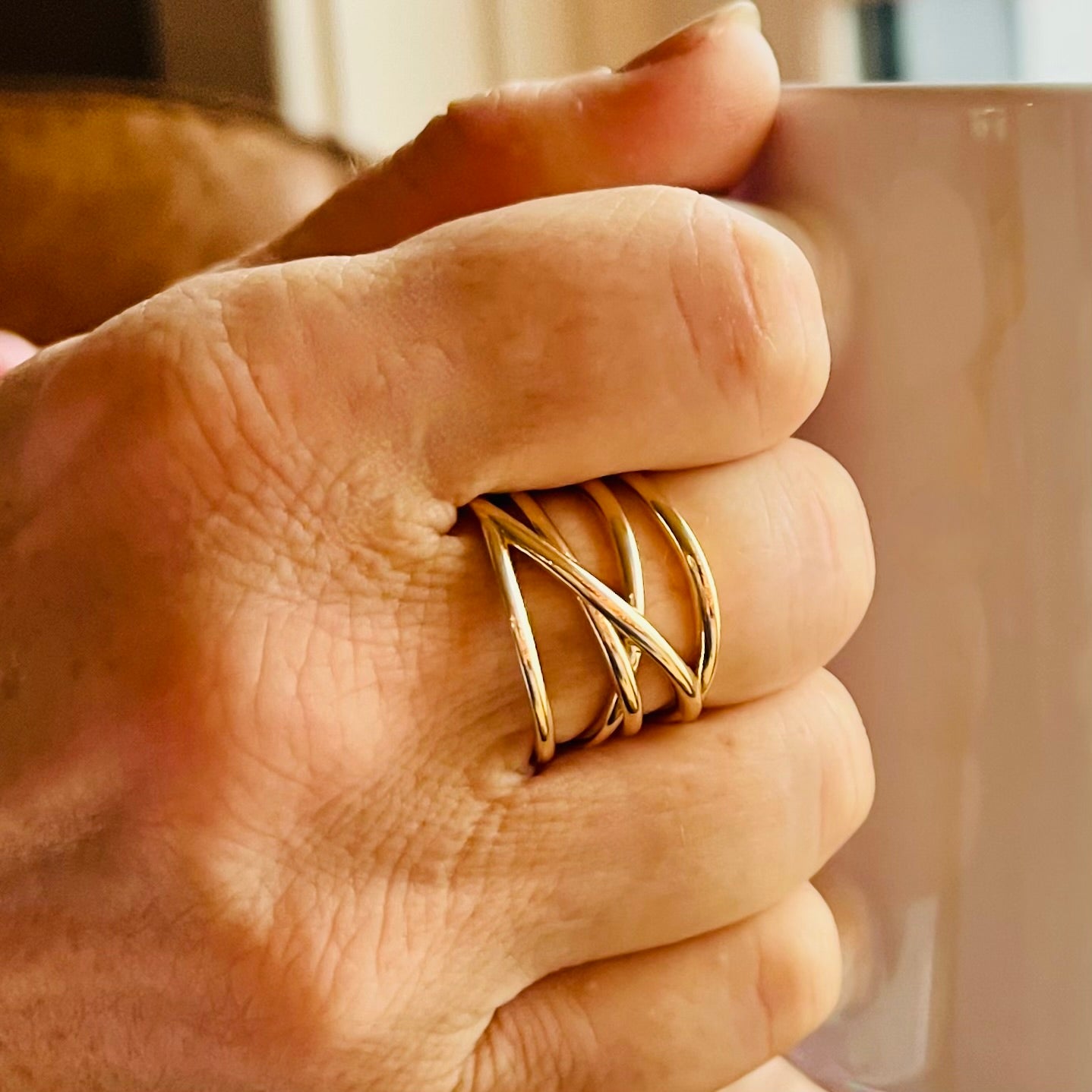 wearing Saturn Ring in 14k yellow gold by Hannah Daye & Co original design hand-crafted