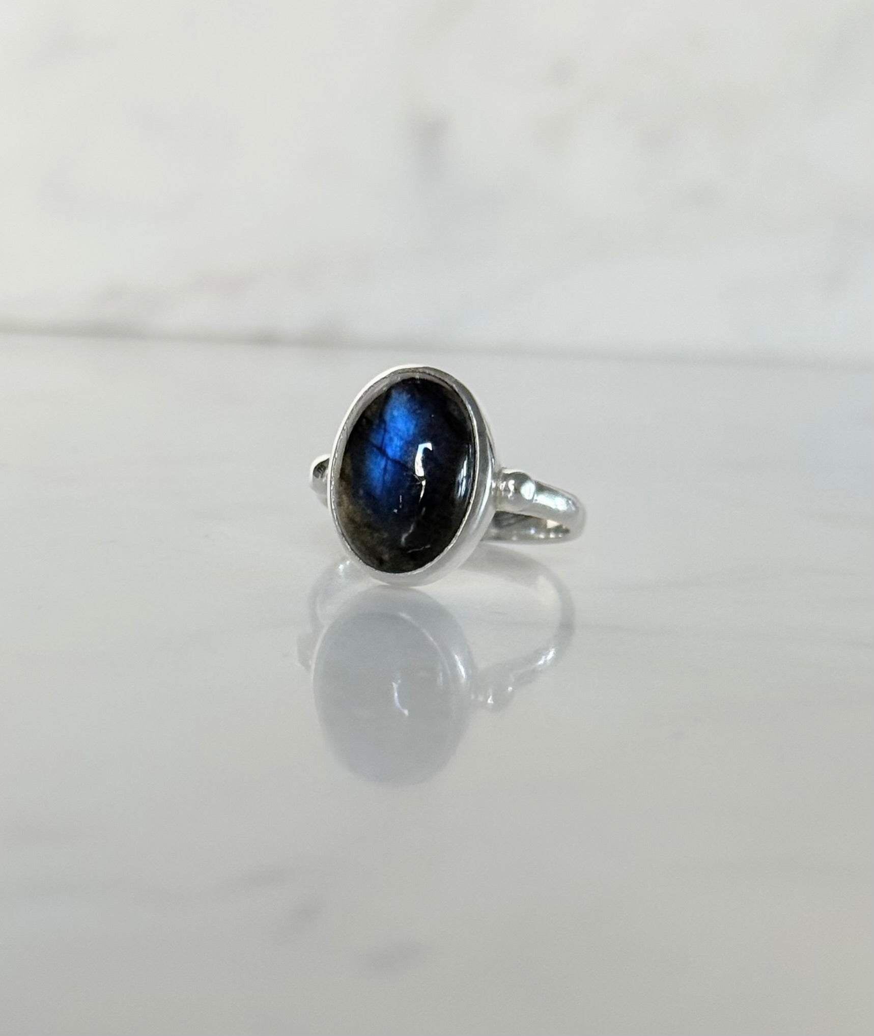 Windsor Ring sterling silver with blue labradorite hand crafted sitting on marble counter