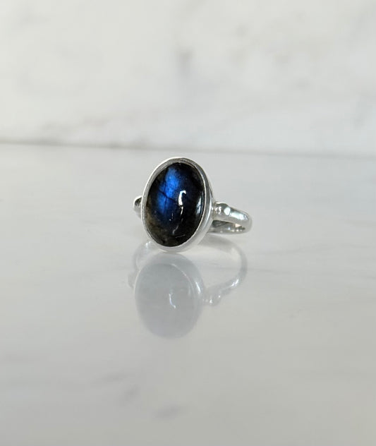 Windsor Ring sterling silver with blue labradorite hand crafted sitting on marble counter