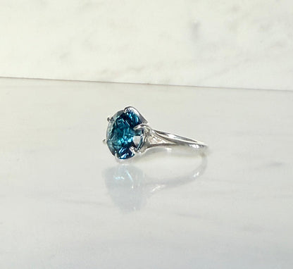 side view of London Blue Topaz Sterling silver ring by Hannah Daye on White Smooth Surface