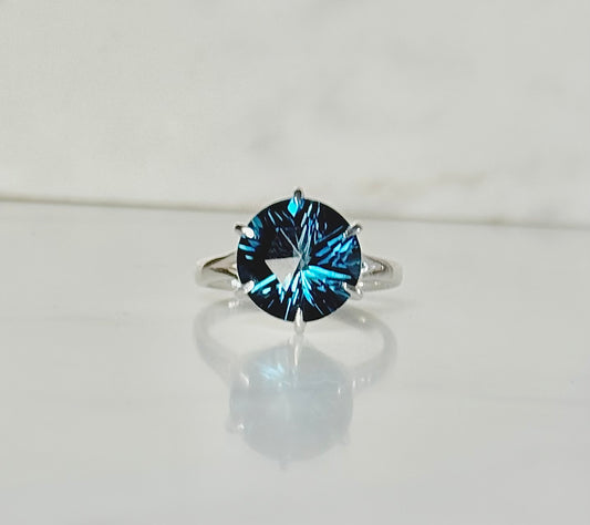 London Blue Topaz Sterling silver Ring by Hannah Daye on white surface
