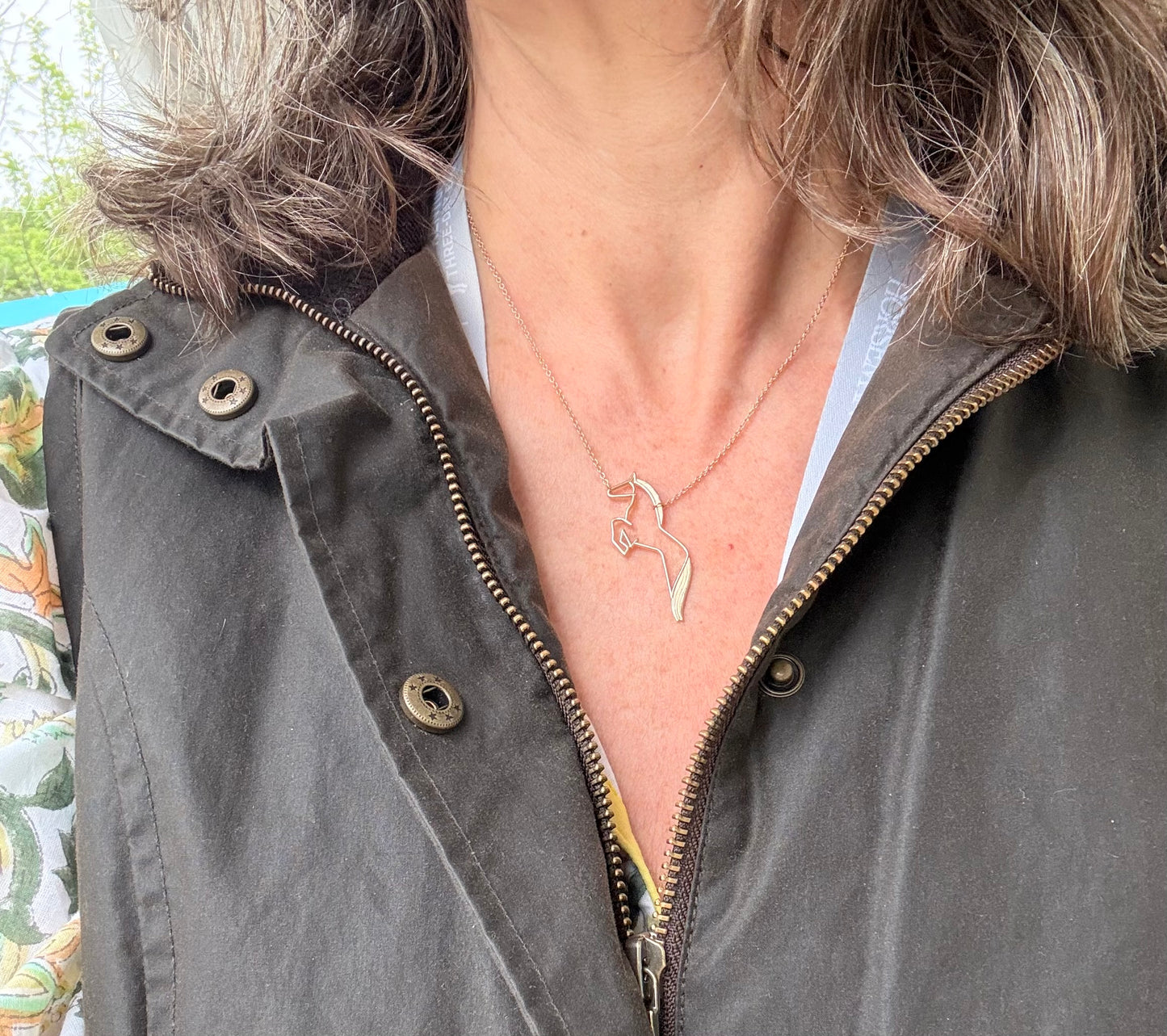 wearing 14k yellow gold equestrian 5 star necklace
