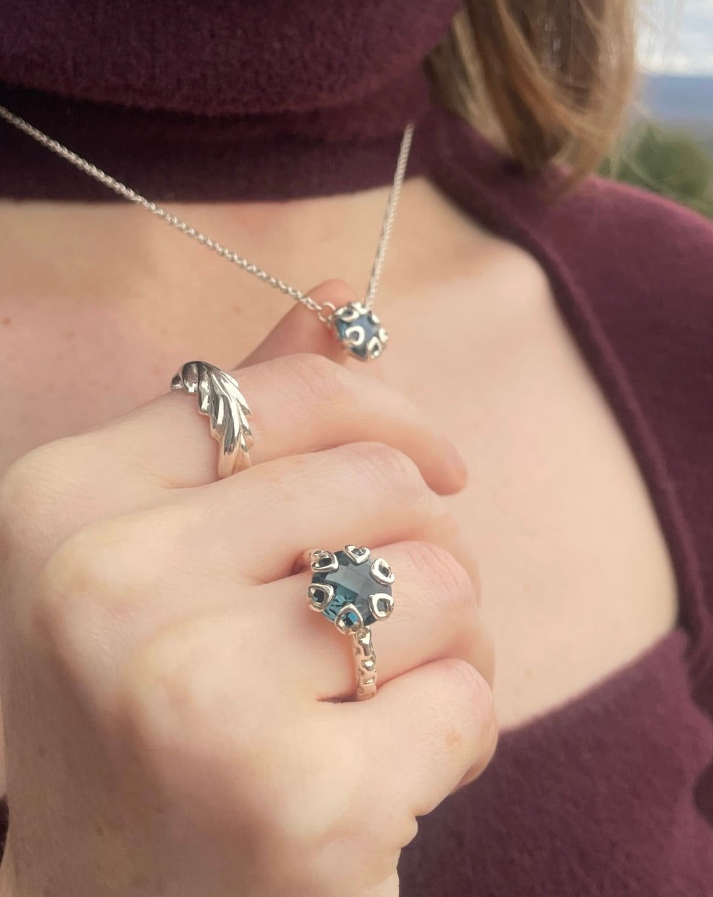 wearing Poppy London Blue Necklace with matching Poppy Ring and Palm Ring all by Hannah Daye original design fine jewelry sterling silver