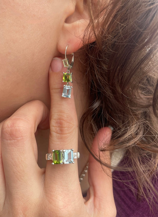 wearing lexi Double Drop Earrings with peridot and sky blue topaz shown with Lexington Ring all by Hannah Daye designer fine jewelry