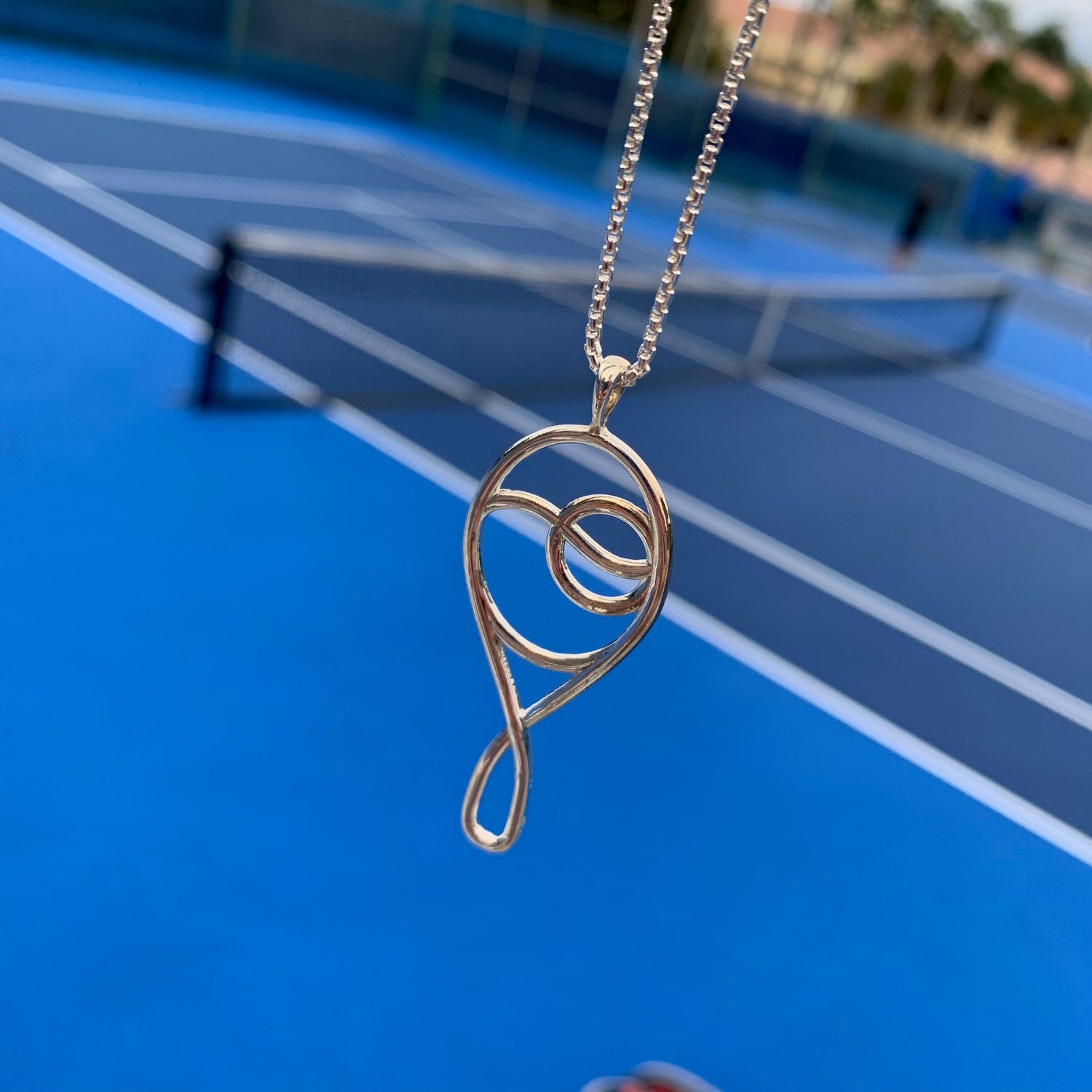 Grand Deuce Tennis Pendant Sterling Silver by Hannah Daye & Co court-side at the Delray Beach Open 