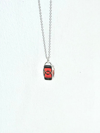 reverse side of sterling pendant with red gemstone
