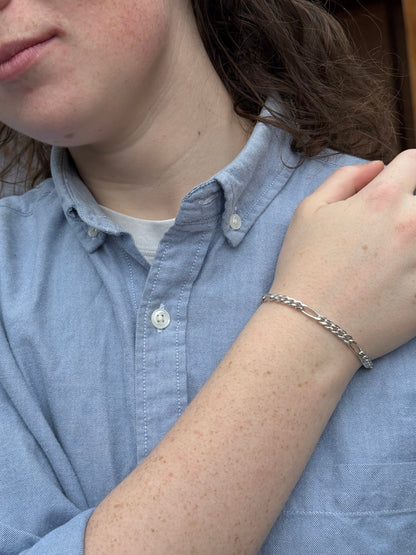 Person wearing a silver bracelet