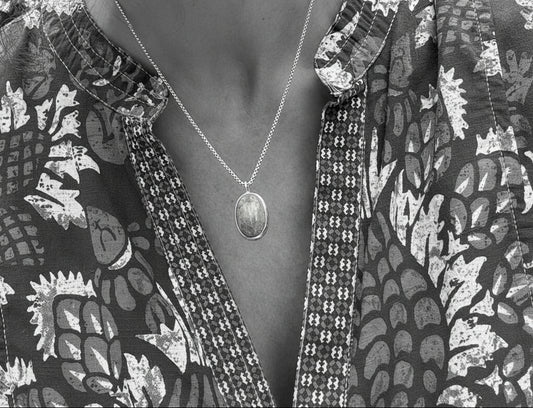 wearing Oslo bezel set pendant by Hannah Daye & Co original design