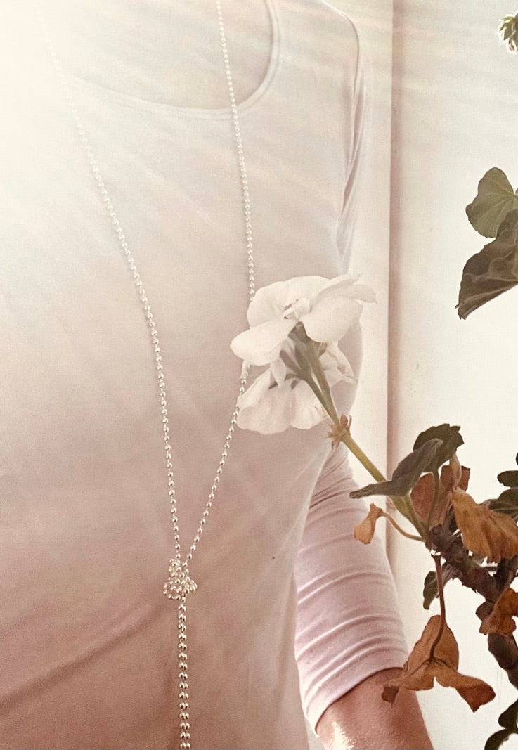 Bead chain necklace tied in knot by Hannah Daye