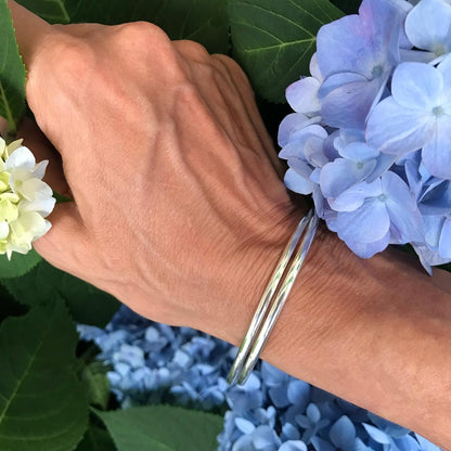 Milan Bangle sterling silver shown with hydrangeas Hannah Daye & Co