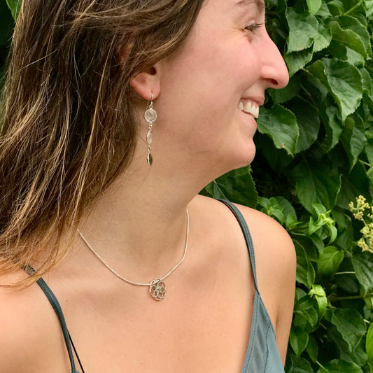 wearing Rosette Plat pendant and Cascade Triple Earrings in Labradorite and Quartz Hannah Daye & Co