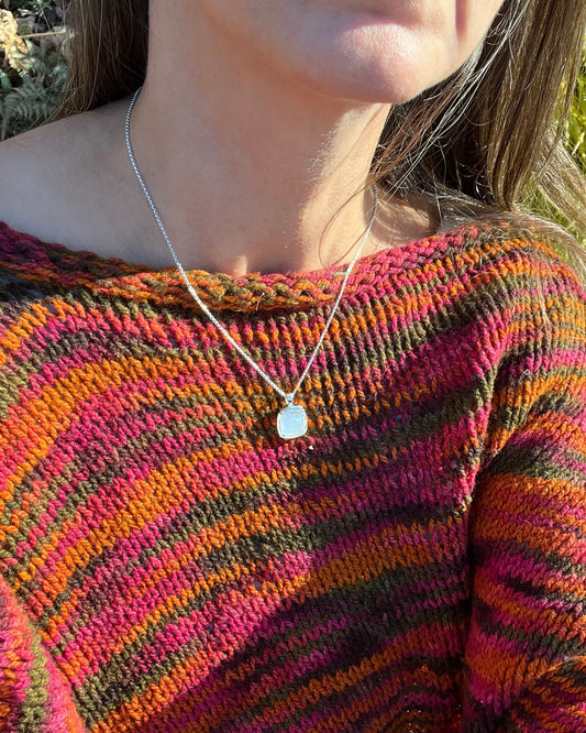 wearing Milan pendant in Mother of Pearl doublet 18" sterling silver by Hannah Daye & Co