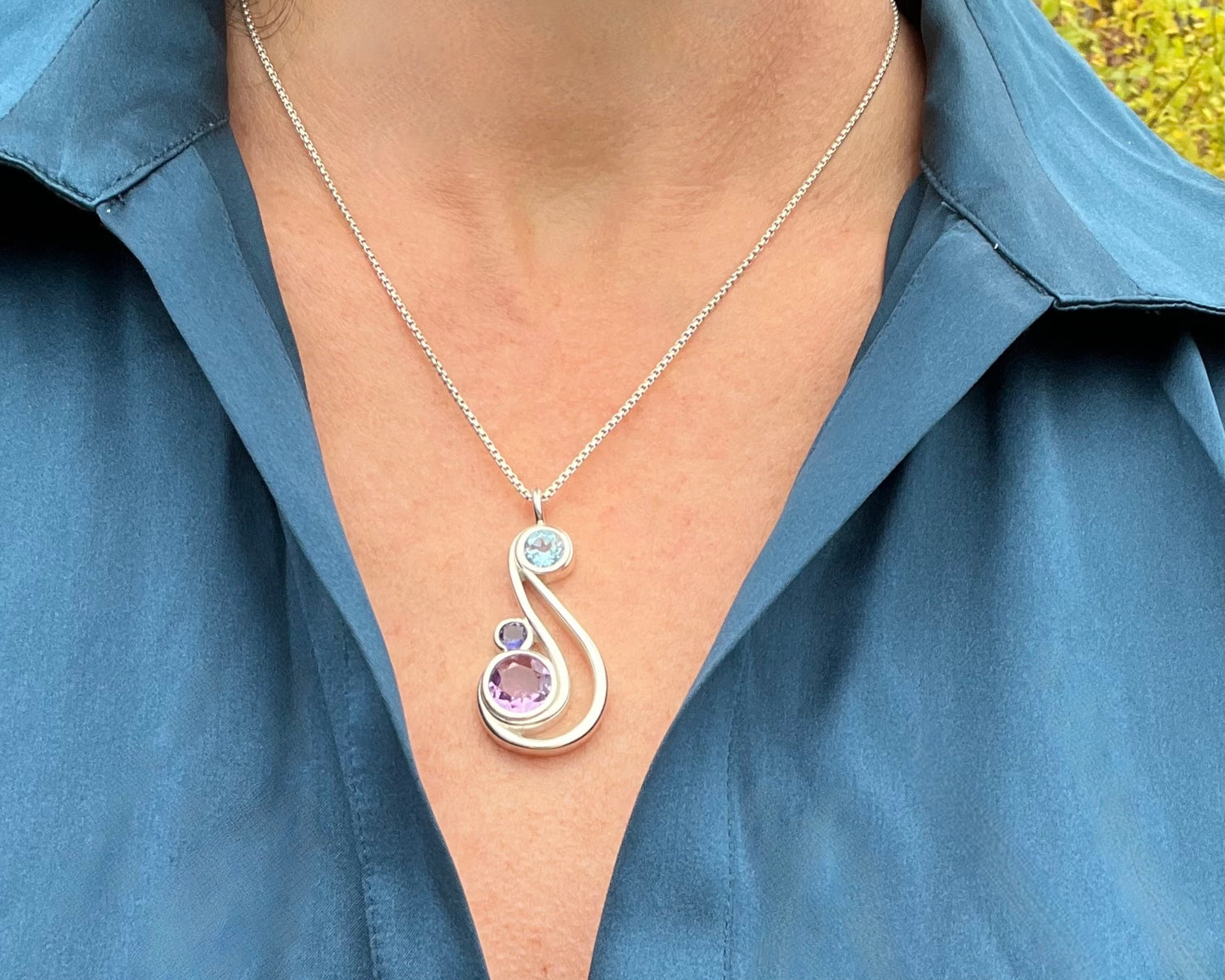 wearing Aria pendant in Iolite, Amethyst and Sky Blue Topaz 18" by Hannah Daye & Co