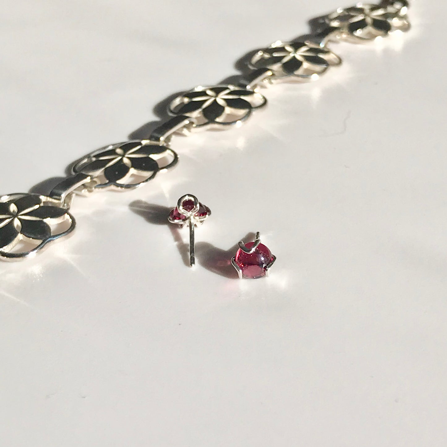 Rosette link bracelet with Fiore Garnet studs Hannah Daye & Company