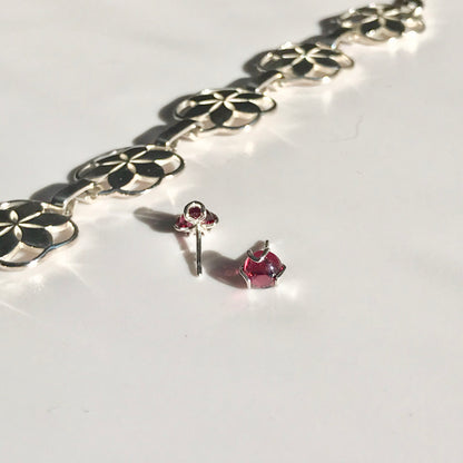 Rosette link bracelet with Fiore Garnet studs Hannah Daye & Company